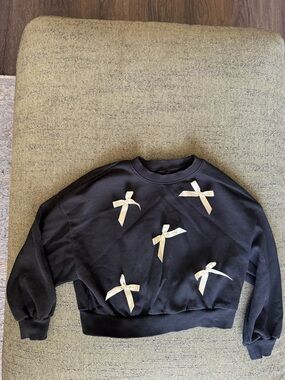 Girls' Black Sweatshirt with Cream Bow Accents